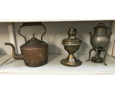 A Victorian copper kettle, oil lamp and pewter samovar.