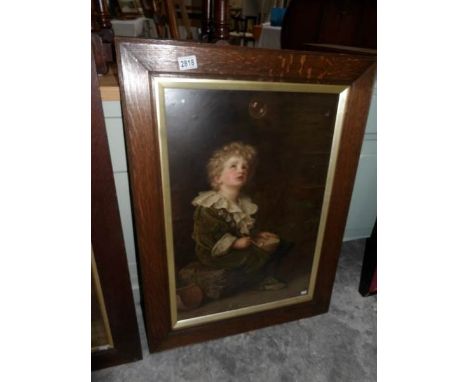 An oak framed and glazed Bubbles print.