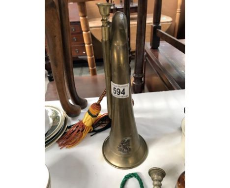 A bugle with later regimental badge and tassels.