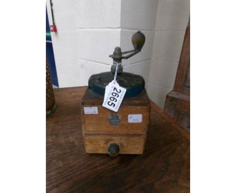 A vintage coffee grinder.