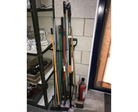 A quantity of garden tools including fork, spade, hoe etc.
