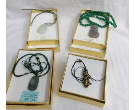 3 jade Buddha pendants and a stone rabbit pendant.