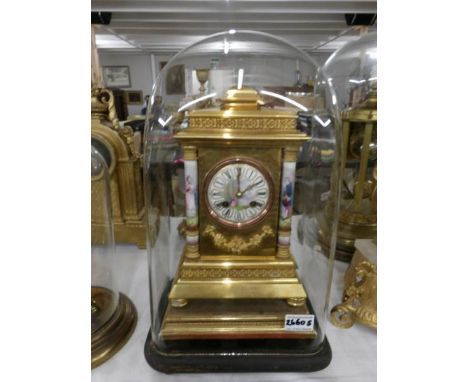 A 19th century French gild mantle clock featuring Sevres panels, named R. M. turner, Paris, under glass dome.
