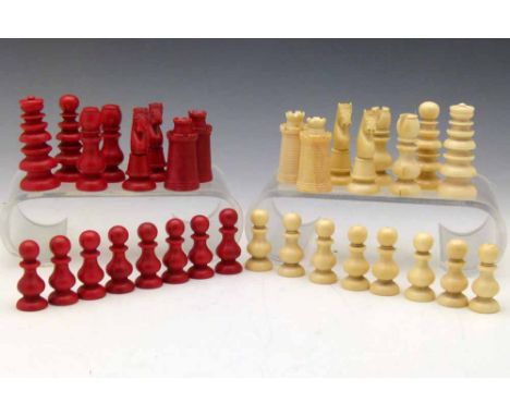 Red and white ivory chess set, 19th century, in the manner of Calvert, all single piece apart from the knights, king height 6