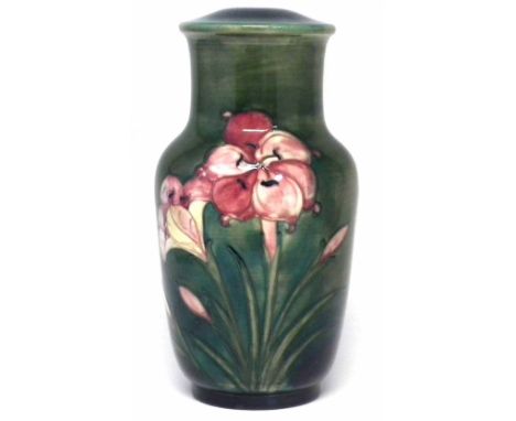 Moorcroft lamp, decorated with Freesia design on a green glaze, 31.5cm high     Condition report: No damage or restoration, o