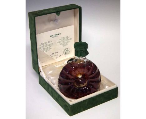 Remy Martin Fine Champagne Cognac, in Baccarat decanter, in case with certificate dated 5th July 1983.     Condition report: 