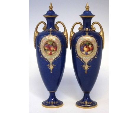 Pair of Royal Worcester vases signed W.Bee, painted with fallen fruit within gilded cartouche on powder blue ground, puce pri