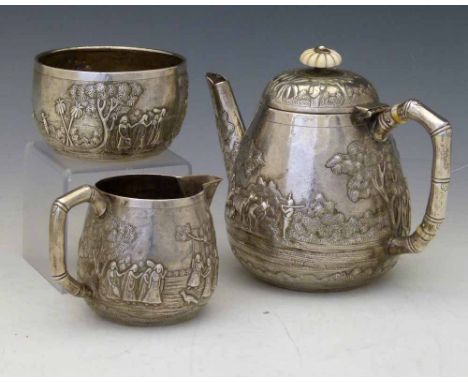 Indian silver three-piece tea set by Grish Chunder Dutt, Bhowanipore, Calcutta, circa 1890, each embossed with a continuous s