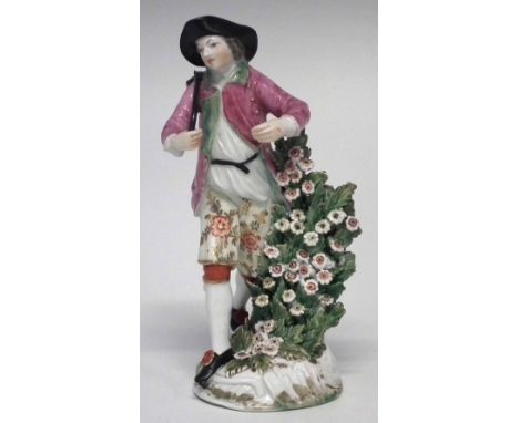 Derby figure of a gentleman circa 1770, modelled carrying a barrel on his back, patch marks to base, 18cm high     Condition 