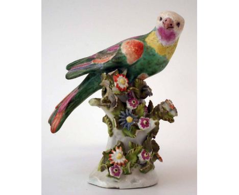 Bow model of a parrot circa 1760, modelled perched on a floral incrusted perch, anchor and crown mark to base, 14cm high     