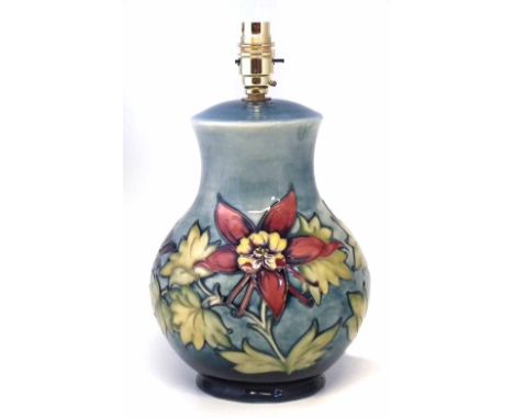 Moorcroft lamp base, decorated with columbine pattern on a blue ground, the ceramic part measures 24cm high    Condition repo