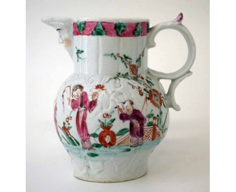 Baddeley-Littler mask jug, circa 1780-85, moulded with cabbage leaves and painted with figures within a garden, 14cm high    