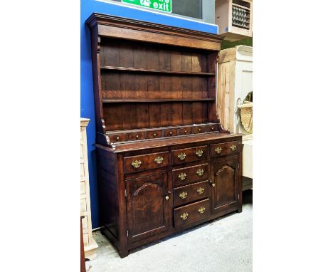 DRESSER, 152cm W x 198cm H x 53cm D, Georgian style oak with a plate rack above drawers and fielded panelled doors. 