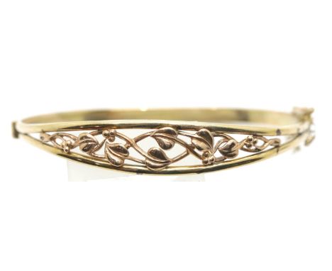 9ct yellow gold bangle with rose gold floral decoration, 11.1g, D: 5.5 cm approximately.  P&amp;P Group 1 (£14+VAT for the fi