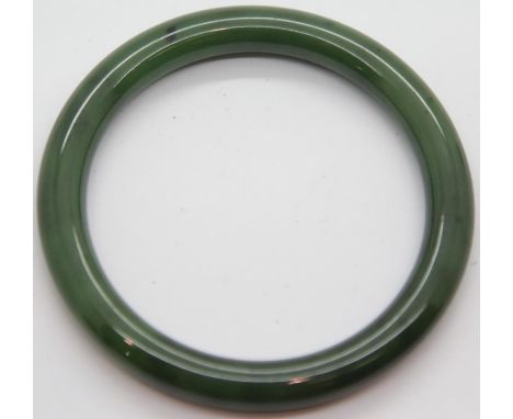 Jade bangle. Exterior 7.5cm Interior 6cm P&amp;P Group 1 (£14+VAT for the first lot and £1+VAT for subsequent lots) 