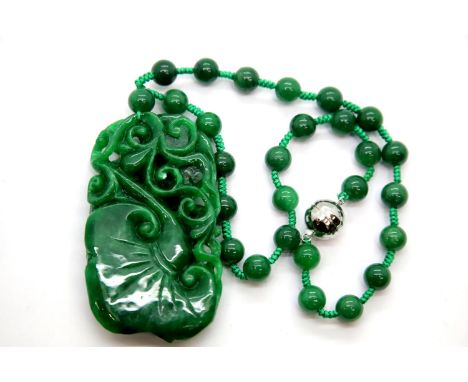 Carved jade pendant (9 x 5 cm) on a jade bead necklace. P&amp;P group 1 (£14 for the first lot and £1 for subsequent lots 