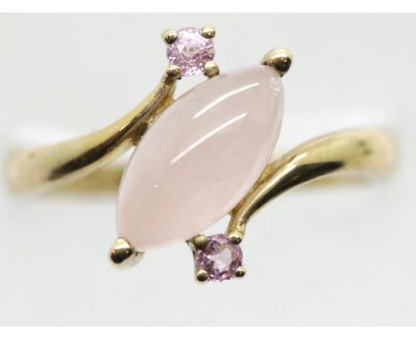 9ct gold rose quartz and pink sapphire set crossover ring, size P, 2.8g. P&amp;P Group 1 (£14+VAT for the first lot and £1+VA