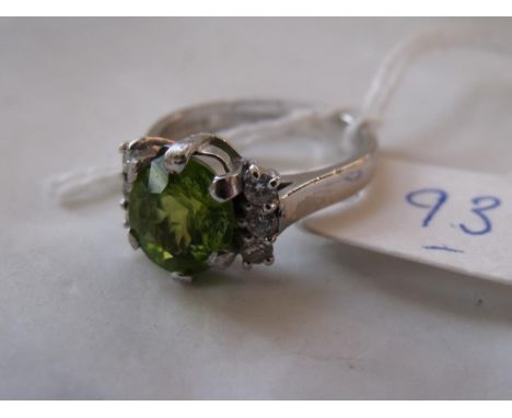 Oval peridot & diamond 18ct seven stone ring   