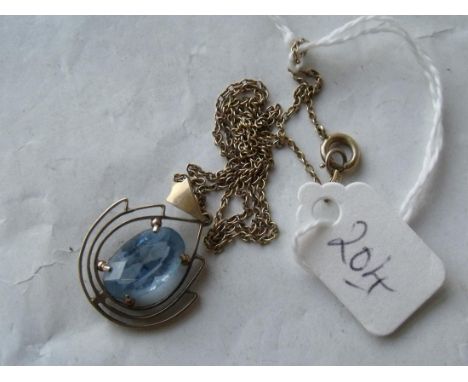 Blue topaz 9ct pendant on 9ct chain     