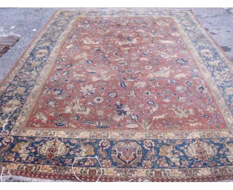 An eastern carpet with equestrian figures hunting  deer 11’6” x 8’6”        