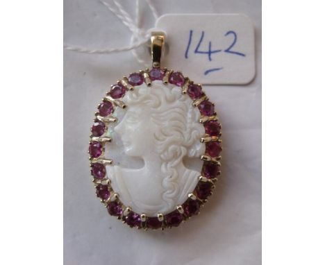An opal carved cameo of lady with multi  ruby surround in 9ct pendant mount    