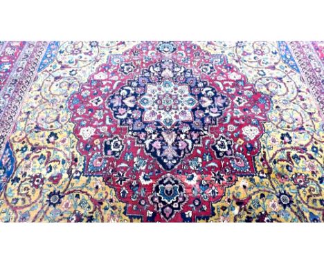 Kashan carpet with red centre medallion with scroll  and gilt surround and red patterned border 16’x12’  