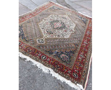 A heavy quality carpet with flower decorated  centre medallion `10’x7’      