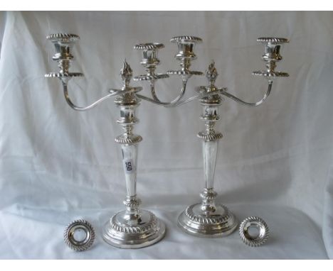 PAIR GEORGIAN TWO LIGHT CANDELABRA the vase  shaped nozzles centered by a flame  motif the whole  with gadroon edges Sheff 18