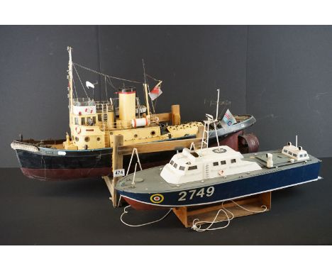 Two painted wooden battery-operated boat models with R/C units, to include a RAF Rescue Vosper 2749 and a 'Comet' trawler fis