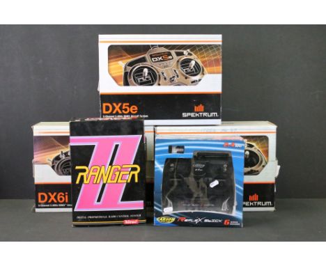 Radio Control - Five boxed R/C radio control systems / controllers to include 3 x Spektrum 2.4GHz DSM2 Aircraft Systems (2 x 