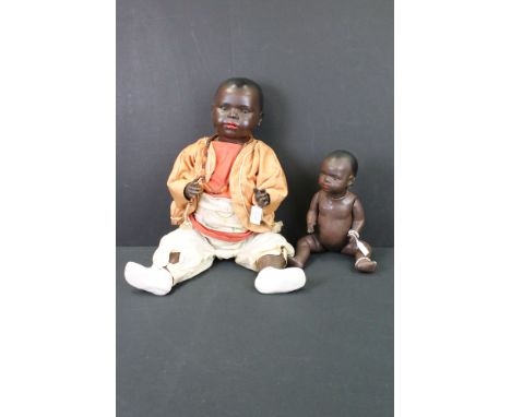 Two Heubach Koppelsdorf Black Bisque Head Baby Dolls, one with impressed number 414.7, 61cm high and the other with impressed