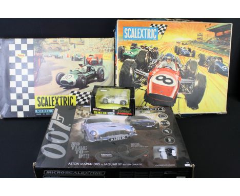 Three boxed Scalextric sets to include Triang FJ31 with 2 x slot cars, 3 x pit lane figures etc, 31 with both slot cars (one 