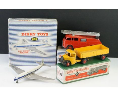 Three boxed Dinky diecast models to include 2 x Supertoys (521 Bedford Articulated Lorry in yellow &amp; 955 Fire Engine with