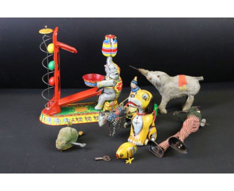 Seven Clockwork Tinplate Toys including Schuco Velvet covered Frog with key, German Performing Circus Elephant with key, Tall