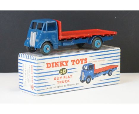 Boxed Dinky 512 Guy Flat Truck diecast model in blue cab with red trailer and lighter blue hubs, a few paint chips but gd ove