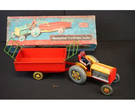 Boxed Mettoy Mechanical Tractor and Trailer No 3262/76, tin plate in vg condition, box damp/mould wear 