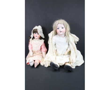 Two Heubach Koppelsdorf Bisque Head Dolls, one with impressed marks 302.9, 73cm high and the other with impressed marks 250.3