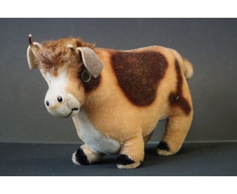 Steiff Bessy Cow with collar and bell (button to ear ), 23cm long together with a Soft Toy Bull, possibly Steiff 