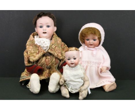 Three Heubach Koppelsdorf Bisque Head Dolls, one with impressed number 267.7, 59cm high, the other with impressed number 267.