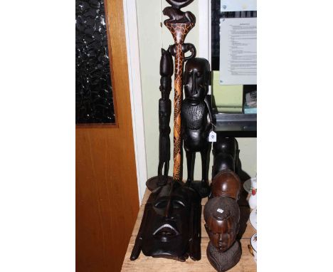 Two tribal masks, two pairs of tribal busts, two figures, stick and shield (9).