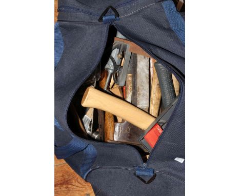 Bag of tools including axes, drill bits, trowel, etc.