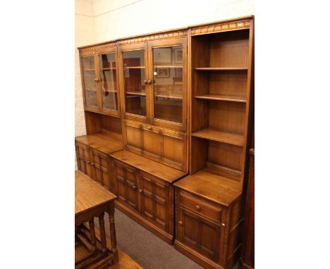 Three section Ercol wall unit and rectangular coffee table.