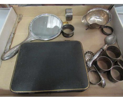 A silver hand mirror, silver flatware, napkin rings, sauce boat etc 