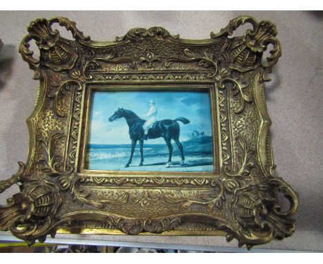 A. WHEELER: An ornately gilt framed oleograph depicting jockey on race horse, signed lower-left