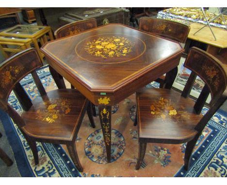 An Italian Indian rosewood games table with marquetry floral inlay. Sections include chessboard, backgammon and roulette, tog