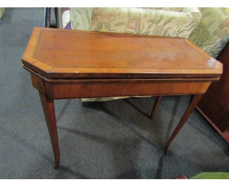 A 19th Century flame mahogany card table, the crossbanded top over canted corners to outswept legs
