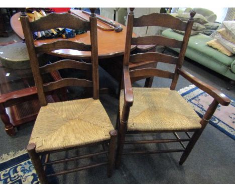 A set of ten (8+2) 18th Century style oak ladder back dining chairs with rush seats    