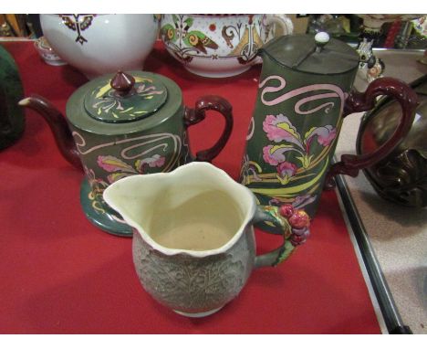 An Art Nouveau Royal Delft teapot and hot water jug, floral design, and a Shorter &amp; Son jug and stand (4)