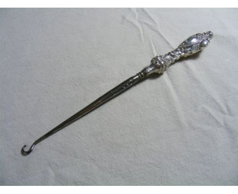 An ornately decorated silver-handled Victorian  Button Hook, bearing hallmark for Birmingham 1896.