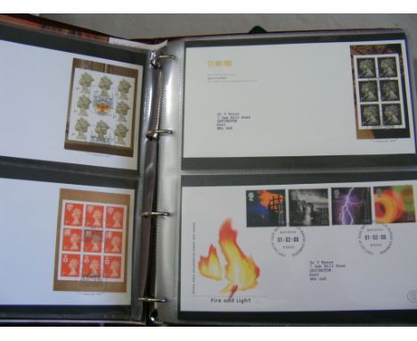 Collection of First Day Covers, together with some  GB mint sets, 1997-2002, contained within two  albums, approx 130 items.